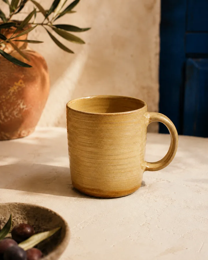 Hand-Thrown Coffee Mug in Wheat Field — warm yellow stoneware mug.